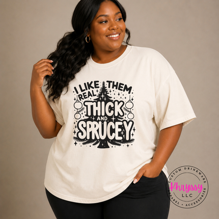 Funny Thick and Sprucey Christmas tree design printed on an Ivory tee.