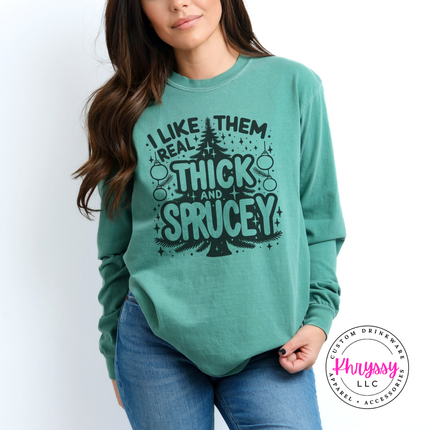 Woman wearing the Thick and Sprucey Christmas long sleeve tee in Light Green.