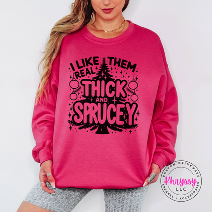 Woman wearing the Thick and Sprucey Christmas crewneck sweatshirt in Heliconia.