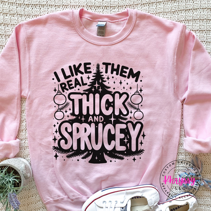 Light Pink crewneck sweatshirt with I Like Them Real Thick and Sprucey tree.