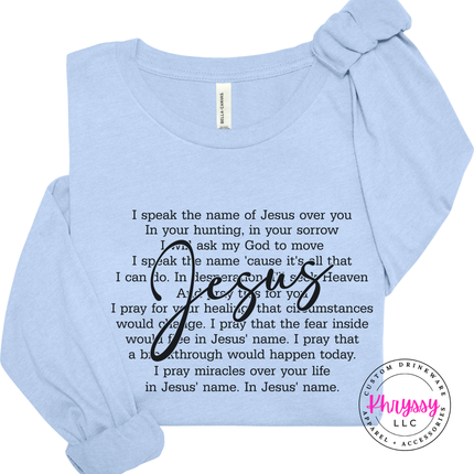 Baby Blue long sleeve showing an I Speak the Name of Jesus prayer design.