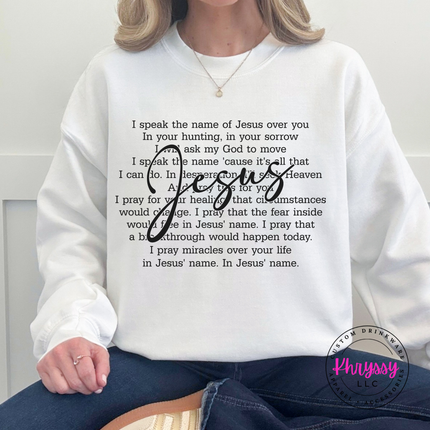 White cozy crewneck printed with a flowing Jesus script prayer graphic.