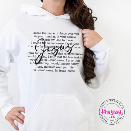 White cozy hoodie printed with a flowing Jesus script prayer graphic.
