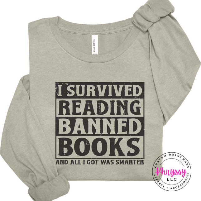 Heather Stone long sleeve featuring bold distressed I Survived Reading Banned Books typography.