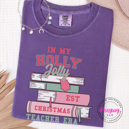 Close up of the Christmas teacher era book design on a Grape long sleeve tee.