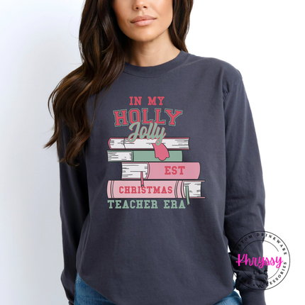 Graphite long sleeve tee with In My Holly Jolly Christmas Teacher Era books.