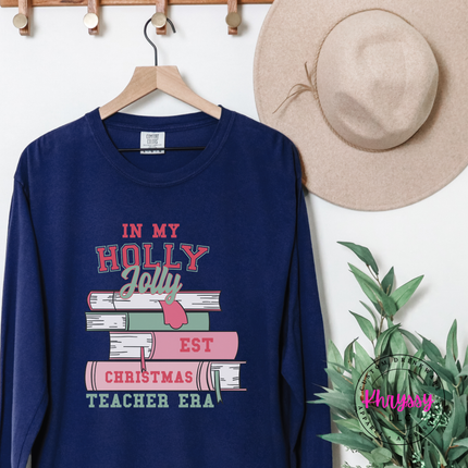 True Navy long sleeve tee featuring varsity lettering on a stack of books.