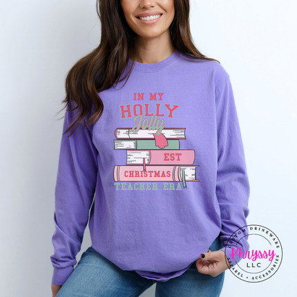 Close up of the Christmas teacher era book design on a Violet long sleeve tee.
