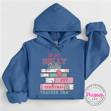 Close up of the Christmas teacher era book design on an Indigo Blue hoodie.
