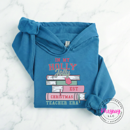 Sapphire hoodie featuring varsity lettering on a stack of books.