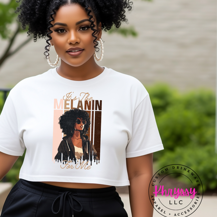 Woman wearing a white t-shirt with a graphic design and text, standing outdoors.
