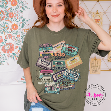 Sage Comfort Colors tee showing vintage Jesus Anthems cassette tapes.