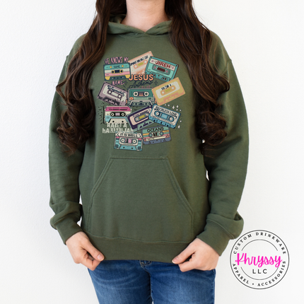 Military Green hoodie showing vintage Jesus Anthems cassette tapes.