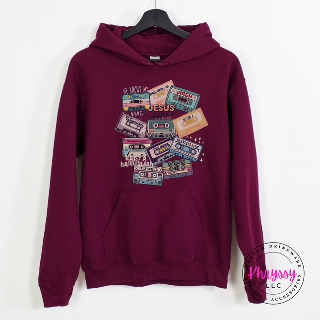 Maroon heavyweight hoodie printed with retro worship anthem cassettes.