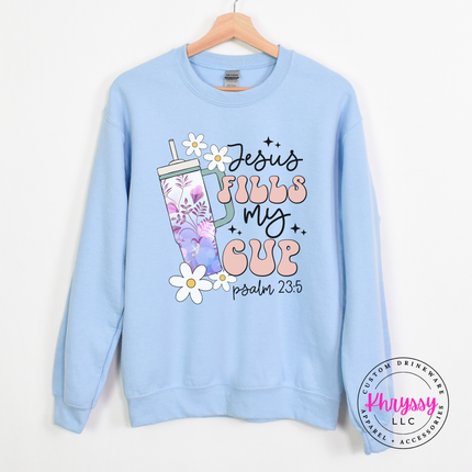 Light blue crewneck showing a retro Psalm 23 cup design.