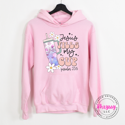 Light pink hoodie with a floral tumbler and Jesus Fills My Cup script.