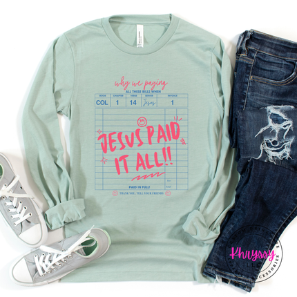 heather dusty blue long sleeve with a pink and blue Jesus Paid It All graphic.