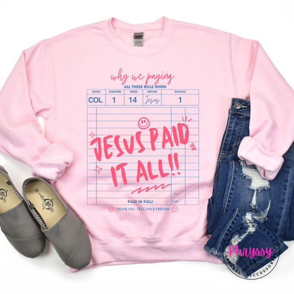 light pink crewneck showing a bold faith receipt and paid-in-full script.