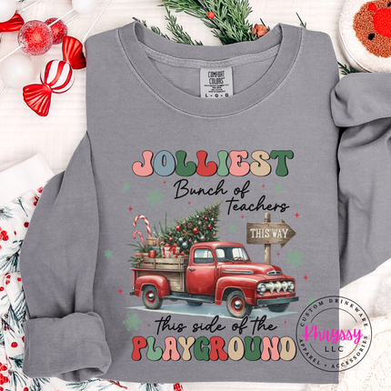 Gray long sleeve tee showing a retro truck with Jolliest Teachers lettering.