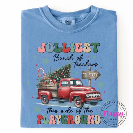 Washed Denim long sleeve tee showing a retro truck with Jolliest Teachers lettering.
