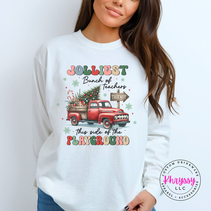Flat lay of the Jolliest Teachers truck Christmas long sleeve tee in White.
