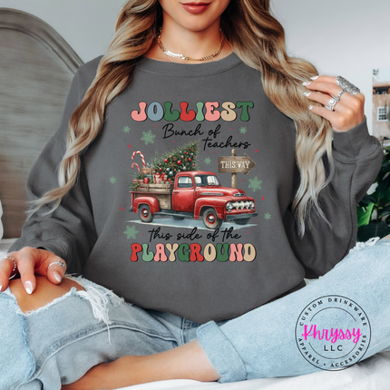 Model wearing the Jolliest Teachers truck crewneck sweatshirt in Charcoal.