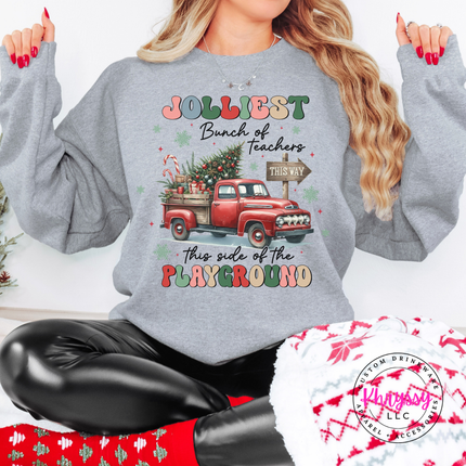 Sport Gray crewneck sweatshirt showing a retro truck with Jolliest Teachers lettering.
