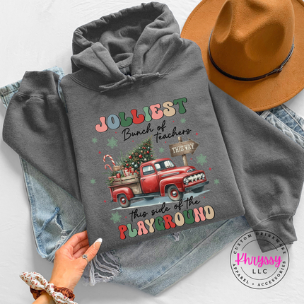 Model wearing the Jolliest Teachers truck hoodie in Charcoal.