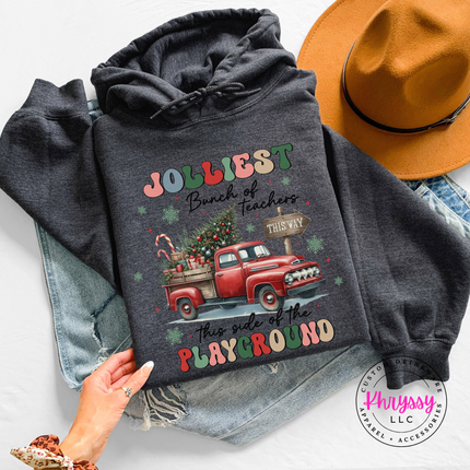 Close up of the Jolliest Teachers truck art on a Dark Heather hoodie.
