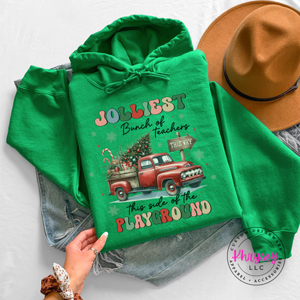 Irish Green hoodie showing a retro truck with Jolliest Teachers lettering.
