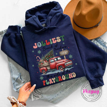 Model wearing the Jolliest Teachers truck hoodie in Navy.