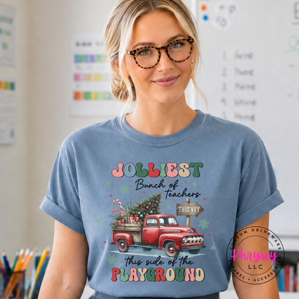 Model wearing the Jolliest Teachers truck tee in Blue Jean.