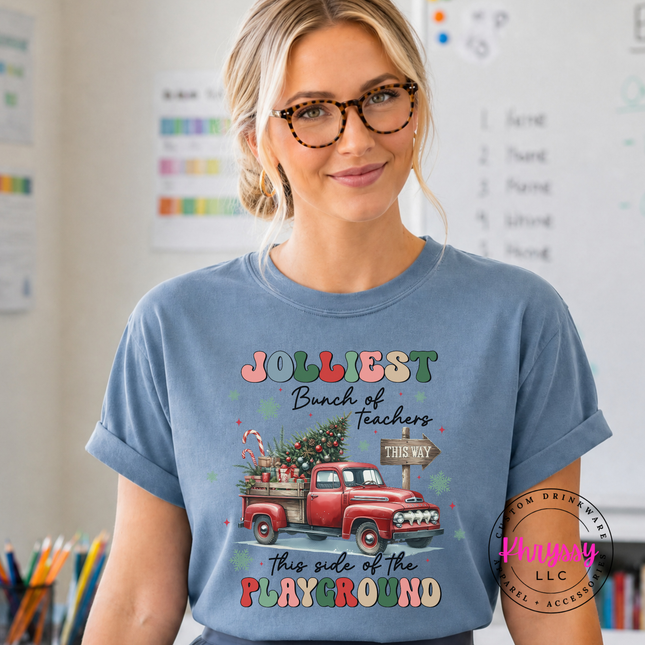 Model wearing the Jolliest Teachers truck tee in Blue Jean.