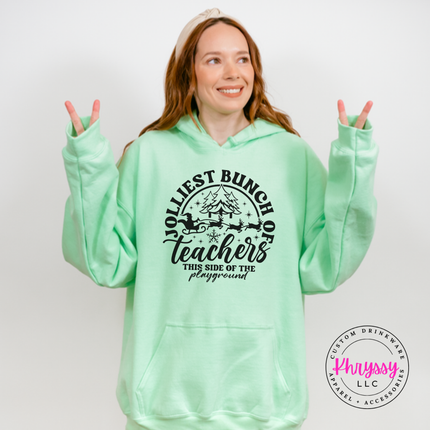 Flat lay of the Jolliest Teachers Christmas hoodie in Mint Green.