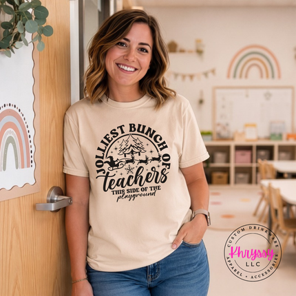 Ivory tee featuring Jolliest Bunch Of Teachers lettering and a sleigh