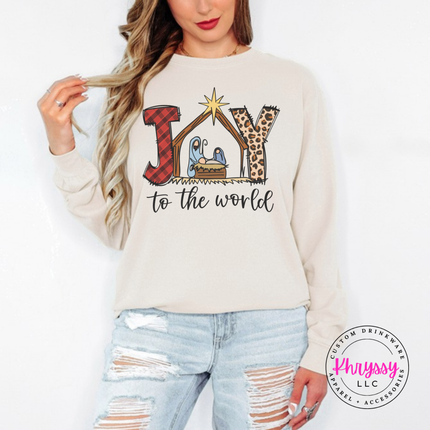 Ivory long sleeve tee featuring a plaid and leopard Joy nativity design.