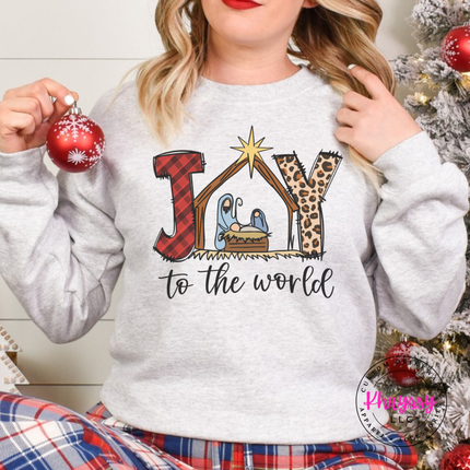 Ash crewneck sweatshirt featuring a plaid and leopard Joy nativity design.