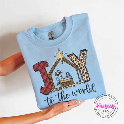 Light Blue crewneck sweatshirt showing Joy To The World with a nativity stable.