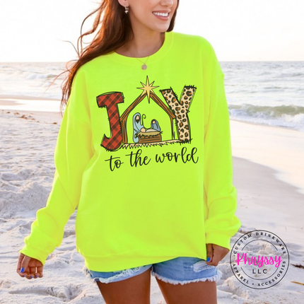 Safety Green crewneck sweatshirt featuring a plaid and leopard Joy nativity design.