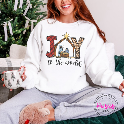 White crewneck sweatshirt showing Joy To The World with a nativity stable.