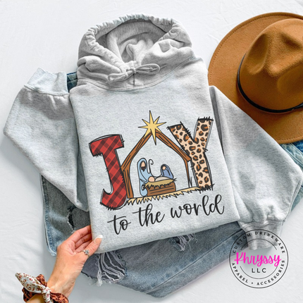 Ash hoodie featuring a plaid and leopard Joy nativity design.