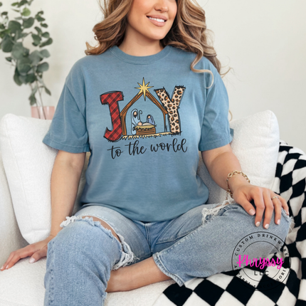 Flat lay of the Joy To The World Christmas tee in Ice Blue.