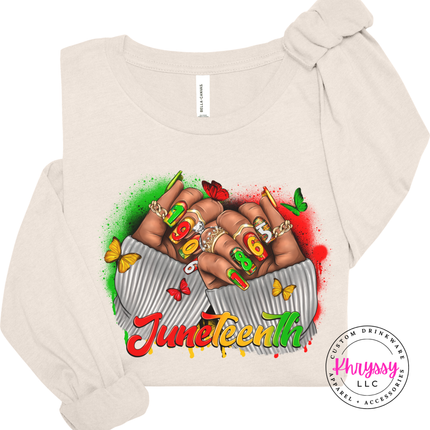 Natural long sleeve tee with a bold Juneteenth 1865 raised fists print.