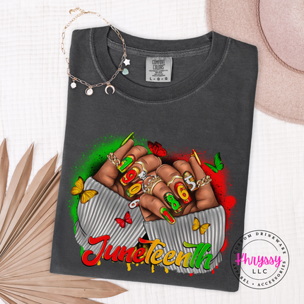 Pepper charcoal tee showing a colorful Juneteenth 1865 fists and butterfly print.