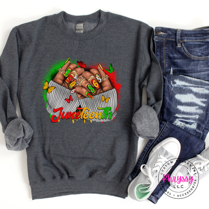 Dark heather crewneck sweatshirt showing a bold Juneteenth 1865 fists print.