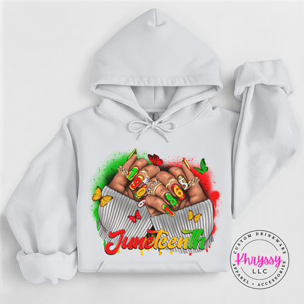 White hoodie with a bright Juneteenth 1865 raised fists graphic.