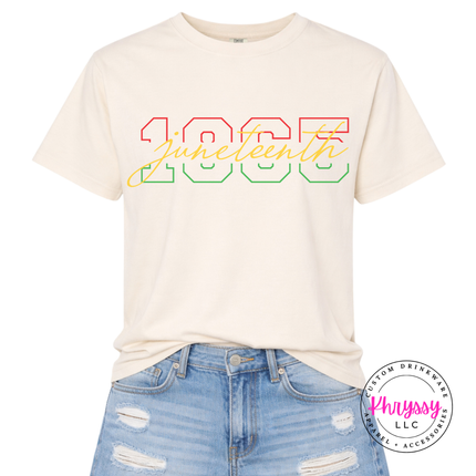 Ivory pigment-dyed tee with a gradient Juneteenth 1865 varsity script design.