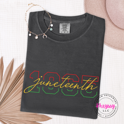 Pepper charcoal tee showing a colorful Juneteenth 1865 varsity number print.