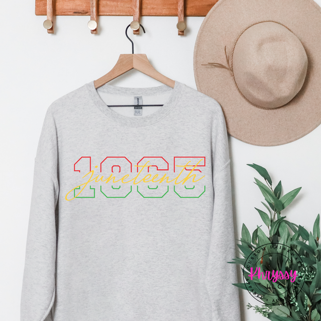Ash grey crewneck sweatshirt with a Juneteenth 1865 varsity script design.