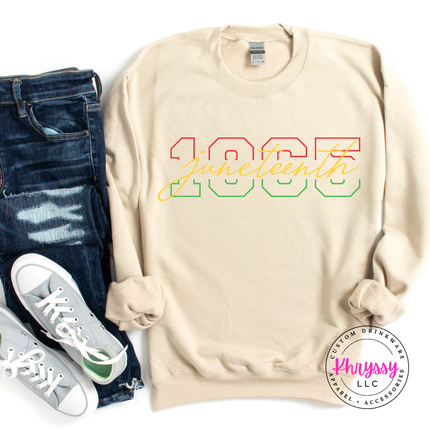 Sand crewneck sweatshirt with a red gold green Juneteenth 1865 varsity design.